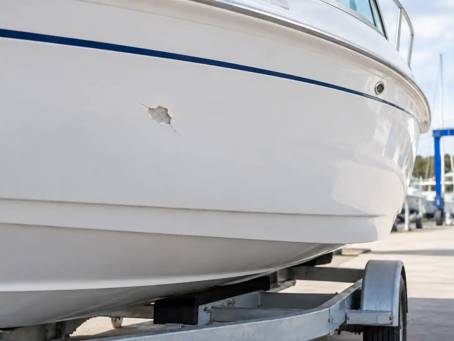 Damaged boat hull before gel-coat repair